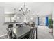 Spacious open-concept living room and dining area with modern lighting and balcony access at 6231 Amber Creek Ln, Indianapolis, IN 46237