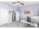 Well-lit home office with a ceiling fan, and neutral paint tones at 6231 Amber Creek Ln, Indianapolis, IN 46237
