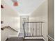 Well-maintained staircase with carpeted steps and sturdy railings, leading to upper floors at 6231 Amber Creek Ln, Indianapolis, IN 46237