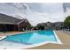 Community swimming pool with ample lounge chairs, providing a relaxing and refreshing experience at 6231 Amber Creek Ln, Indianapolis, IN 46237