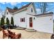 Backyard patio with two Adirondack chairs, grill, and access to red back door at 6611 Valley Mills Ave, Indianapolis, IN 46241