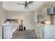 Relaxing bedroom with carpet, ceiling fan, a neutral color scheme, and a large decorative mirror at 6611 Valley Mills Ave, Indianapolis, IN 46241