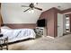 Bedroom with a ceiling fan, TV, neutral carpet, and access to an ensuite bathroom at 6611 Valley Mills Ave, Indianapolis, IN 46241