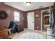 Cozy bedroom with neutral carpet, desk with rolling chair, accent wall, and good natural light at 6611 Valley Mills Ave, Indianapolis, IN 46241