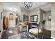 Charming dining area with wood floors and a view into the modernized kitchen at 6611 Valley Mills Ave, Indianapolis, IN 46241