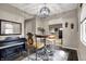 Elegant dining area with stylish lighting, seating, and a charming view into the entry at 6611 Valley Mills Ave, Indianapolis, IN 46241