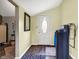 Inviting entryway with neutral walls, modern water filter and hardwood floors at 6611 Valley Mills Ave, Indianapolis, IN 46241