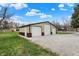 Large detached garage with three bays and a gravel driveway at 6611 Valley Mills Ave, Indianapolis, IN 46241