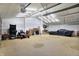 Spacious garage interior with overhead lighting and ample storage space at 6611 Valley Mills Ave, Indianapolis, IN 46241