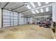 Three-bay garage featuring ample storage space and multiple doors at 6611 Valley Mills Ave, Indianapolis, IN 46241