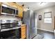 Spacious kitchen boasts stainless appliances, hardwood floors, and ample storage at 6611 Valley Mills Ave, Indianapolis, IN 46241