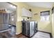Well-equipped laundry room with modern appliances and hardwood floors at 6611 Valley Mills Ave, Indianapolis, IN 46241