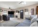 Inviting living room with cozy seating, neutral tones, a ceiling fan, and a TV, creating a comfortable and relaxing space at 6611 Valley Mills Ave, Indianapolis, IN 46241
