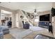 Spacious living room with a ceiling fan, comfortable seating, and an open staircase, creating a welcoming and relaxed atmosphere at 6611 Valley Mills Ave, Indianapolis, IN 46241