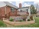 Landscaped backyard featuring a wooden deck and garden, perfect for outdoor living at 6628 Moss Cir, Indianapolis, IN 46237