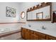 Elegant bathroom boasts a soaking tub, double sink vanity, and a large mirrored cabinet at 6628 Moss Cir, Indianapolis, IN 46237