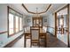 Formal dining room featuring a chandelier, decorative ceiling, and ample seating at 6628 Moss Cir, Indianapolis, IN 46237