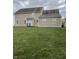 Spacious backyard featuring a large green lawn at 6816 Russett Dr, Plainfield, IN 46168