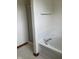 Clean white bathroom tub and glass door shower with tiled walls at 6816 Russett Dr, Plainfield, IN 46168