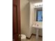Cozy bathroom featuring pedestal sink and updated lighting, ready for your custom upgrades at 6816 Russett Dr, Plainfield, IN 46168