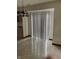 Bright dining area featuring sliding glass door with vertical blinds and kitchen access at 6816 Russett Dr, Plainfield, IN 46168