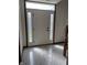 Inviting foyer with decorative glass sidelights and overhead transom window allowing natural light at 6816 Russett Dr, Plainfield, IN 46168