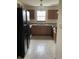 Efficient kitchen layout with granite countertops, wood cabinets, and easy access to adjacent rooms at 6816 Russett Dr, Plainfield, IN 46168