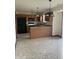 Spacious kitchen with stone countertops, tiled floors, modern appliances, and open floor plan at 6816 Russett Dr, Plainfield, IN 46168