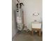 Clean utility sink with hot water tank, ready for various household tasks and projects at 6816 Russett Dr, Plainfield, IN 46168