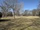 A large grassy backyard with scattered mature trees offers plenty of room at 7164 Sandalwood Dr, Avon, IN 46123