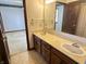 Bathroom vanity and mirror with doorway leading to bedroom at 7164 Sandalwood Dr, Avon, IN 46123