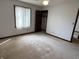Bedroom featuring window, carpeted flooring, and spacious closet at 7164 Sandalwood Dr, Avon, IN 46123