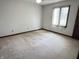Bedroom with a window, carpeted flooring, and neutral walls at 7164 Sandalwood Dr, Avon, IN 46123