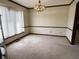 A dining room featuring a classic chandelier and large window at 7164 Sandalwood Dr, Avon, IN 46123