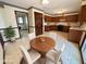 Eat-in kitchen featuring wood cabinets and modern appliances at 7164 Sandalwood Dr, Avon, IN 46123