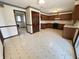 Spacious kitchen featuring linoleum flooring, wood cabinets and modern appliances at 7164 Sandalwood Dr, Avon, IN 46123