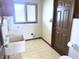 Laundry room including utility sink, window, and access to the exterior at 7164 Sandalwood Dr, Avon, IN 46123