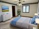 Staged main bedroom with a bed, dresser, and window offering ample natural light at 7164 Sandalwood Dr, Avon, IN 46123