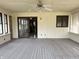 Clean sunroom with neutral walls, striped flooring, and windows for natural light at 7164 Sandalwood Dr, Avon, IN 46123