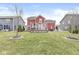 Expansive backyard showcasing a deck, outdoor seating, and a lush lawn perfect for entertaining at 7254 Cambridge Pl, Avon, IN 46123