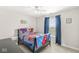 Comfortable bedroom with a ceiling fan, window, and themed bedding, offering a cozy and personalized space at 7254 Cambridge Pl, Avon, IN 46123