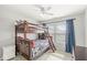 Charming bedroom with a bunk bed, ceiling fan, and window, perfect for a room or guest room at 7254 Cambridge Pl, Avon, IN 46123