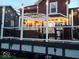 An illuminated deck features wicker furniture and an outdoor television at 7254 Cambridge Pl, Avon, IN 46123