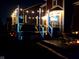 The back deck features string lights, an outdoor TV, and a dining area at 7254 Cambridge Pl, Avon, IN 46123