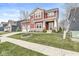 Beautiful two-story home with a red exterior, well-manicured lawn, and inviting front porch at 7254 Cambridge Pl, Avon, IN 46123