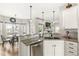 Open kitchen with granite counters, stainless dishwasher, and view to dining area and living room at 7254 Cambridge Pl, Avon, IN 46123