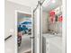 Laundry room is conveniently located near a bedroom and features shelving and a sliding barn door at 7254 Cambridge Pl, Avon, IN 46123