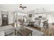 Open-concept living room with hardwood floors and seamless flow to the kitchen and dining area at 7254 Cambridge Pl, Avon, IN 46123