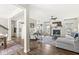 Spacious living room with a fireplace, ceiling fan, and hardwood floors at 7254 Cambridge Pl, Avon, IN 46123