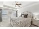 Inviting main bedroom with tray ceilings, a ceiling fan, and neutral decor at 7254 Cambridge Pl, Avon, IN 46123